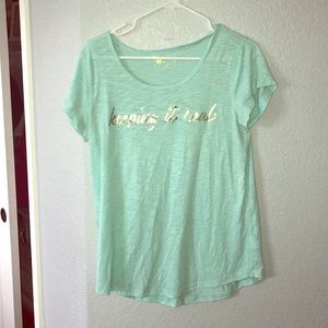 A T-shirt that has words on the front.